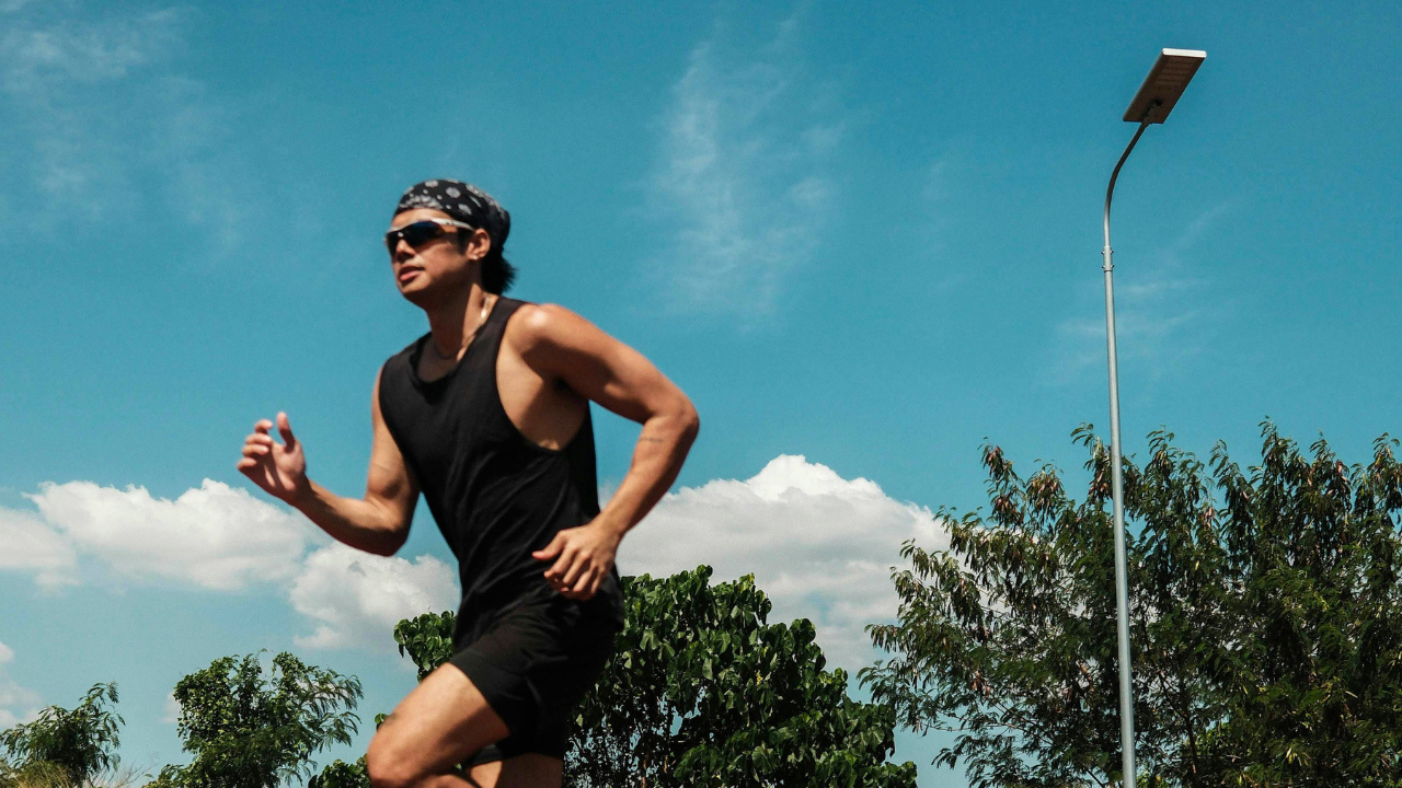 Athlete running outdoors during mental performance training